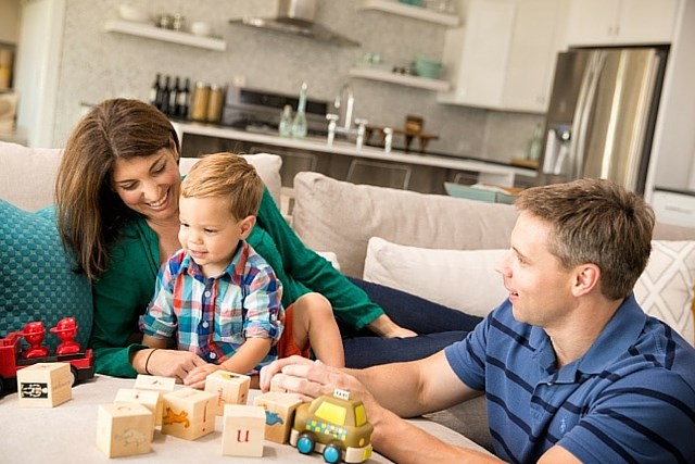 Family playing in living room area