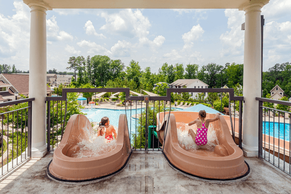 kids going down water slides in Briar Chapel