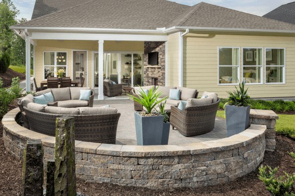 Backyard patio with stone wall