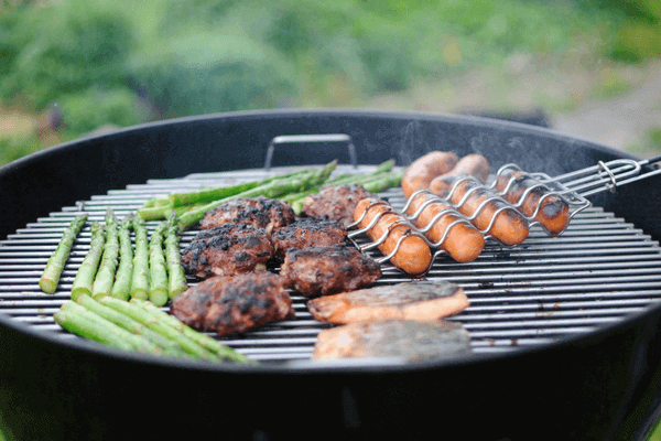 outdoor grill with steak and asparagus