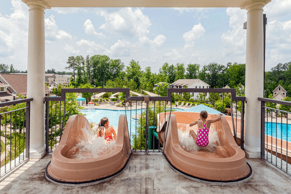 kids enjoying water slides at pool