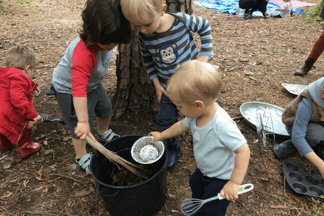 Kids playing outdoors at Tinkergarten