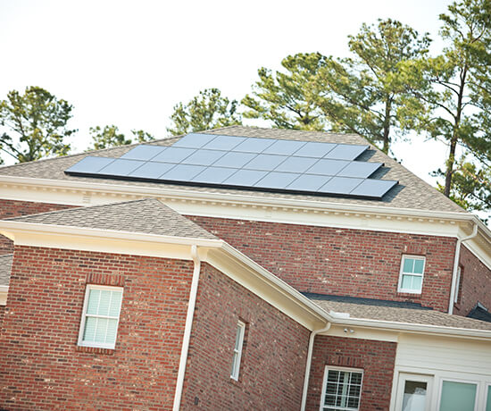 Home with roof solar panels