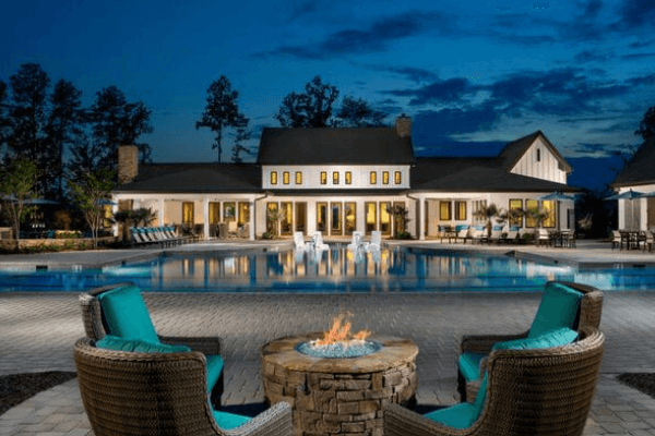 Encore clubhouse and pool at dusk