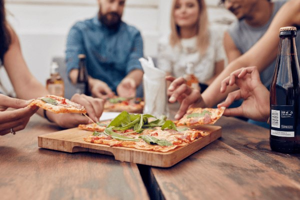 Pizza on wooden block