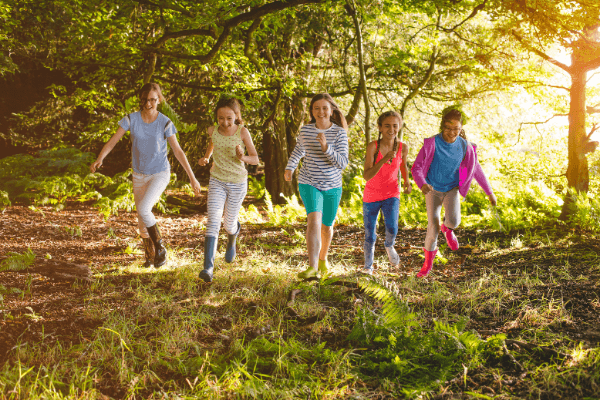 kids running in woods