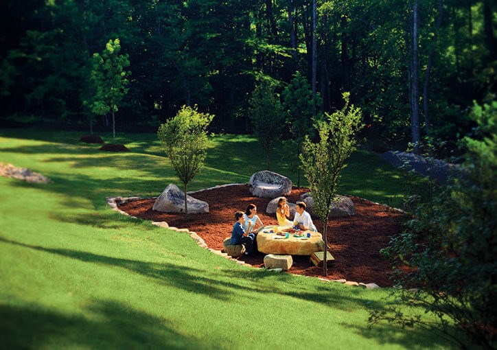 family enjoying picnic in Briar Chapel park