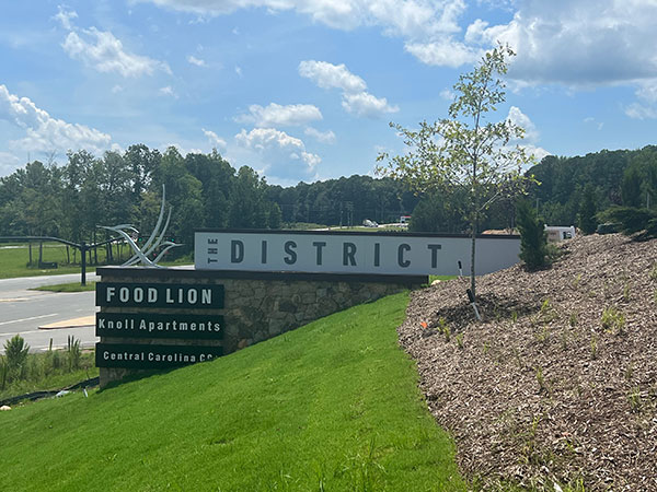 Sign for The District retail and commercial area in Briar Chapel